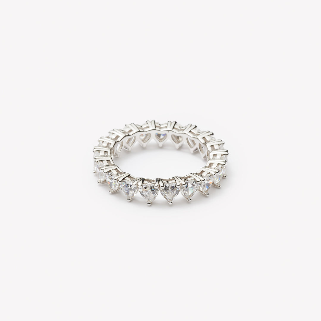 Heart cut eternity ring by IRALIS – Zurich-designed fine jewelry featuring DEF color and VS1–VS2 clarity.