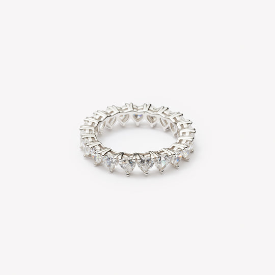 Heart cut eternity ring by IRALIS – Zurich-designed fine jewelry featuring DEF color and VS1–VS2 clarity.