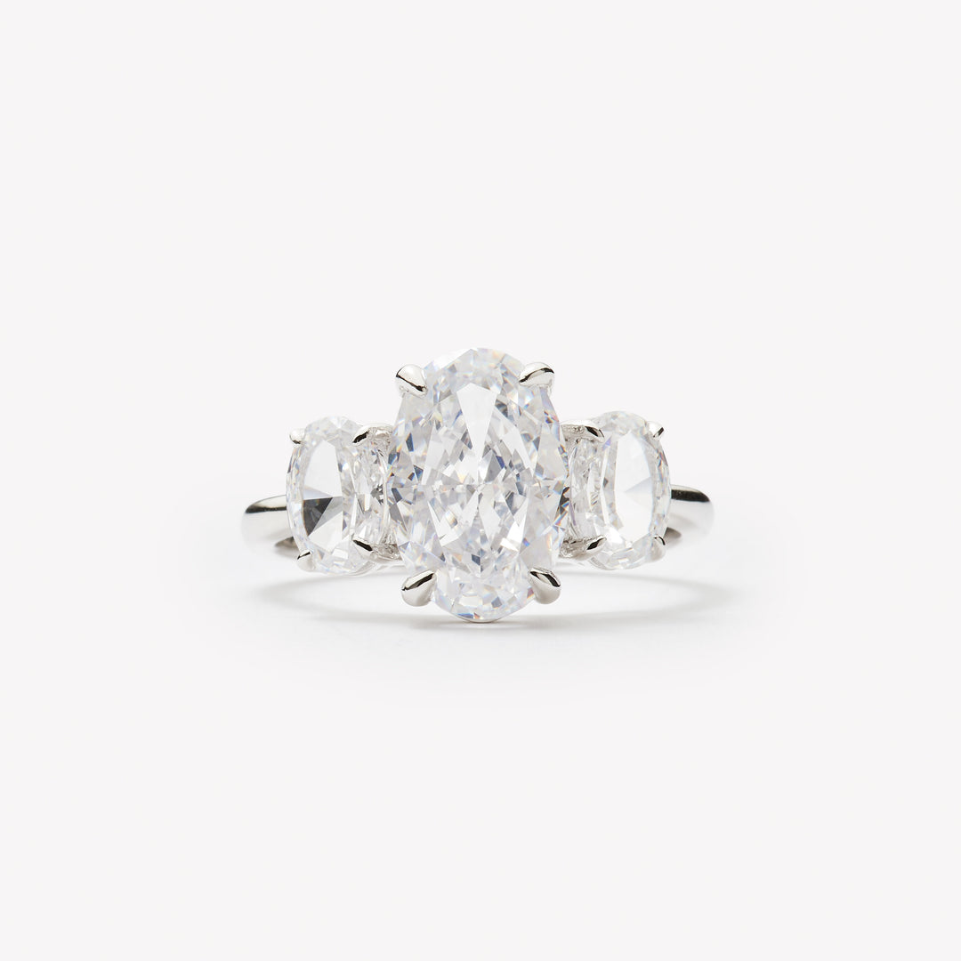 Oval cut three-stone engagement ring by IRALIS featuring lab-grown diamonds in DEF color and VS1–VS2 clarity, Zurich designed