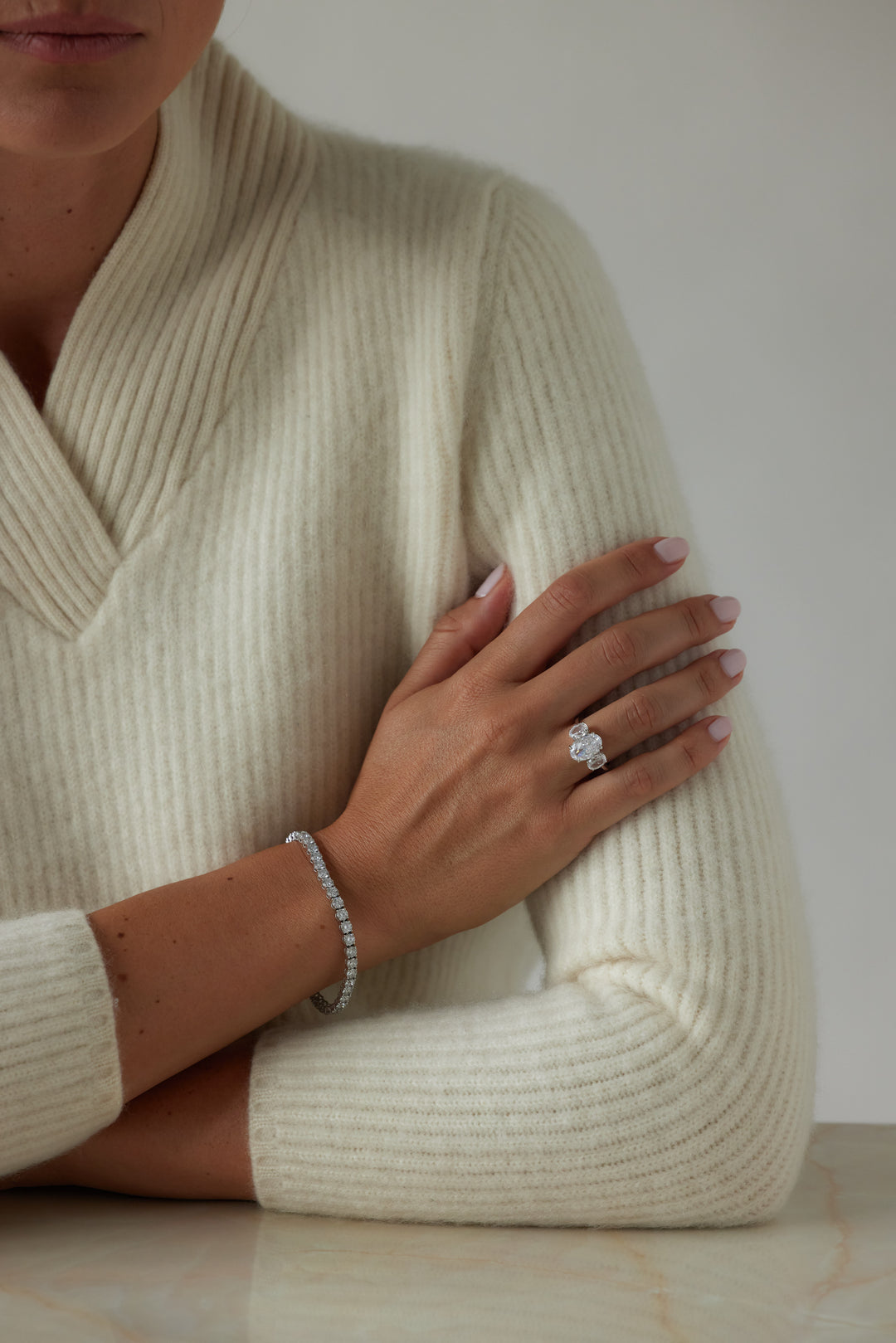 Oval cut three-stone engagement ring by IRALIS featuring lab-grown diamonds in DEF color and VS1–VS2 clarity, Zurich designed