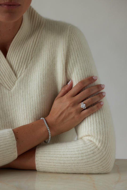 Oval cut three-stone engagement ring by IRALIS featuring lab-grown diamonds in DEF color and VS1–VS2 clarity, Zurich designed