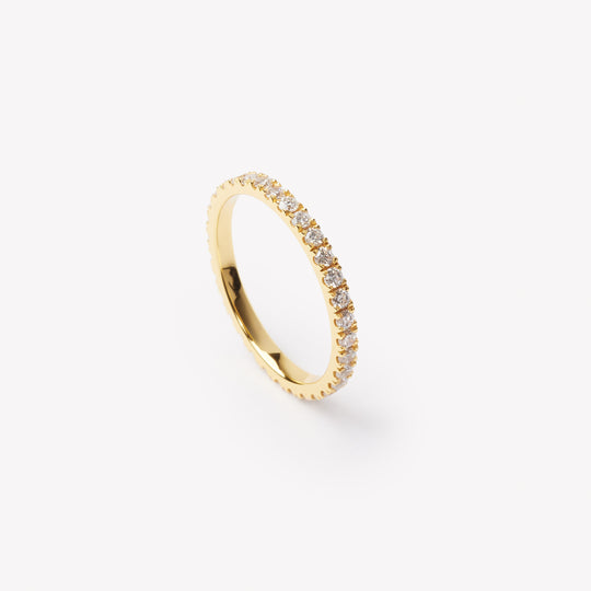 Round brilliant cut eternity ring by IRALIS featuring lab-grown diamonds in DEF color and VS1–VS2 clarity, Zurich designed
