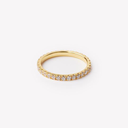 Round brilliant cut eternity ring by IRALIS featuring lab-grown diamonds in DEF color and VS1–VS2 clarity, Zurich designed