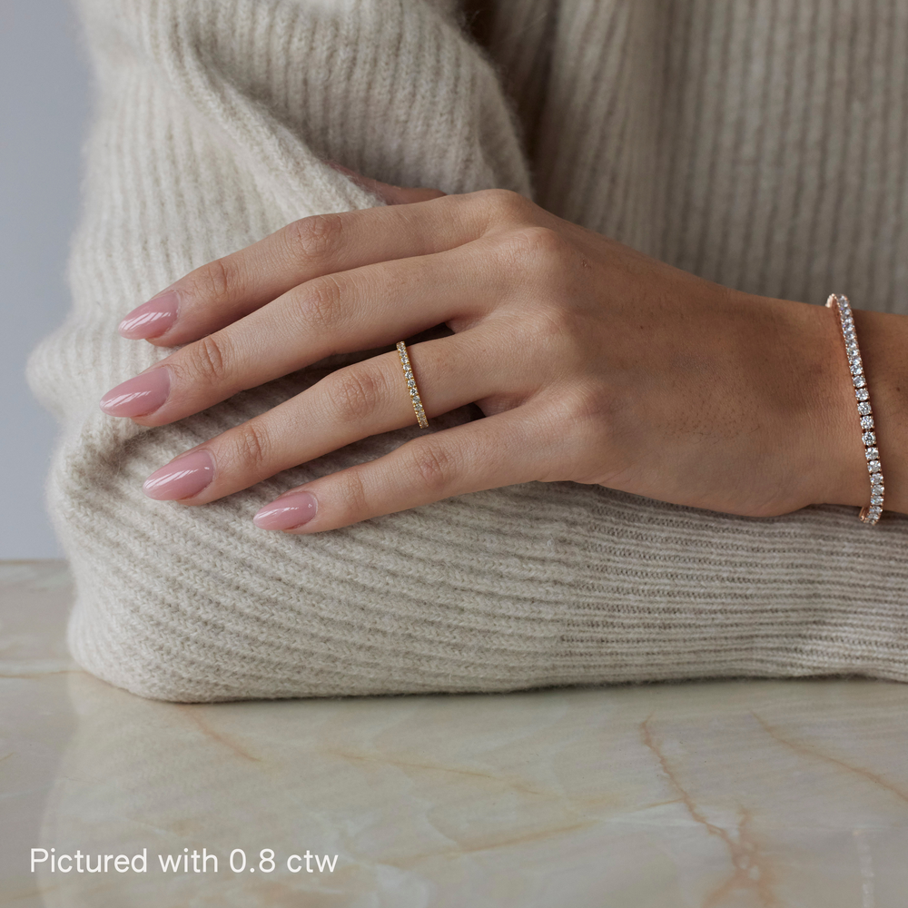Round brilliant cut eternity ring by IRALIS featuring lab-grown diamonds in DEF color and VS1–VS2 clarity, Zurich designed