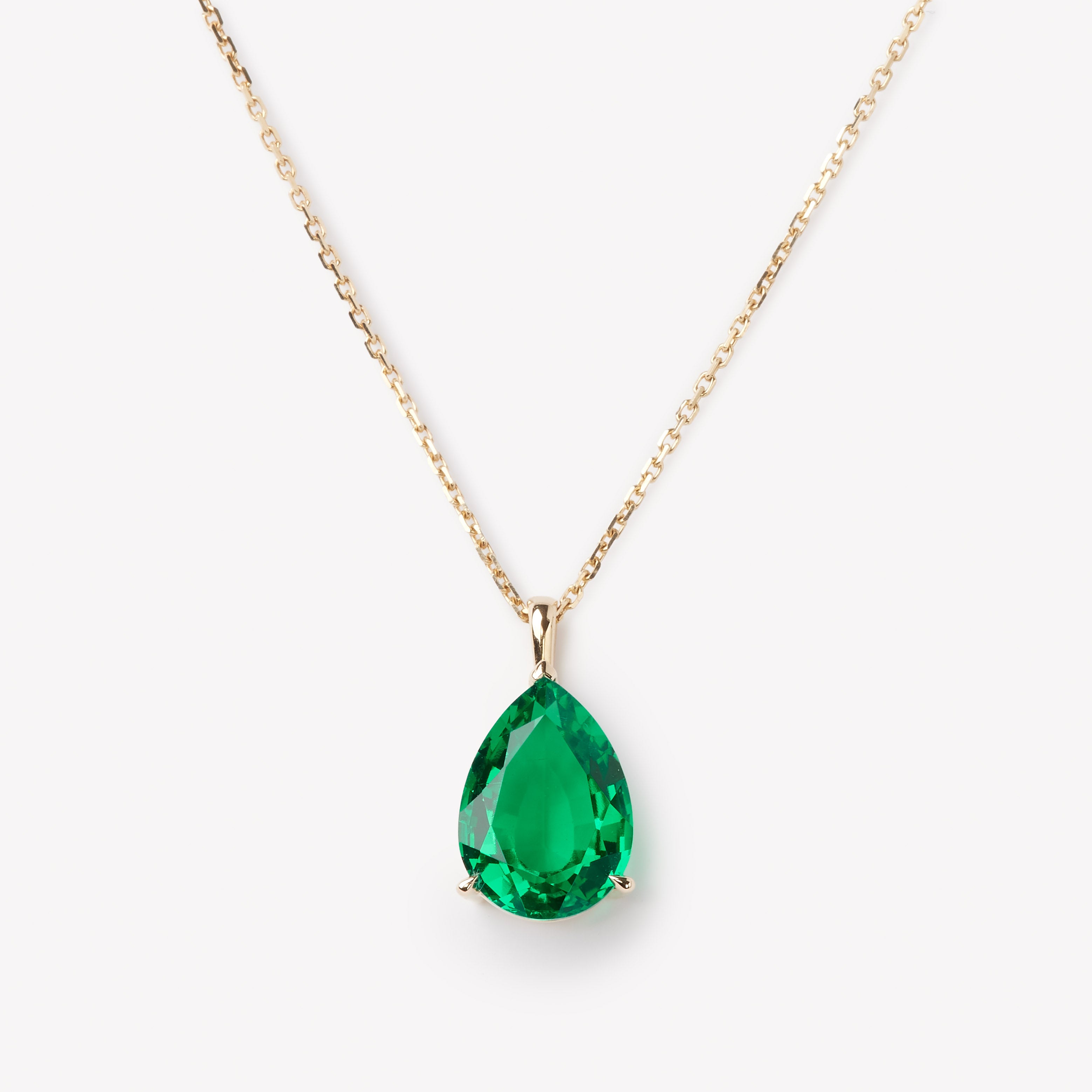 Elegant pear cut necklace by IRALIS showcasing lab-grown emeralds, Zurich designed and custom made