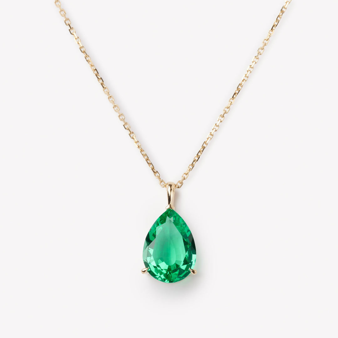 Elegant pear cut necklace by IRALIS showcasing lab-grown emeralds, Zurich designed and custom made