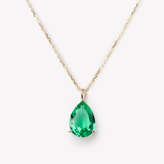 Elegant pear cut necklace by IRALIS showcasing lab-grown emeralds, Zurich designed and custom made