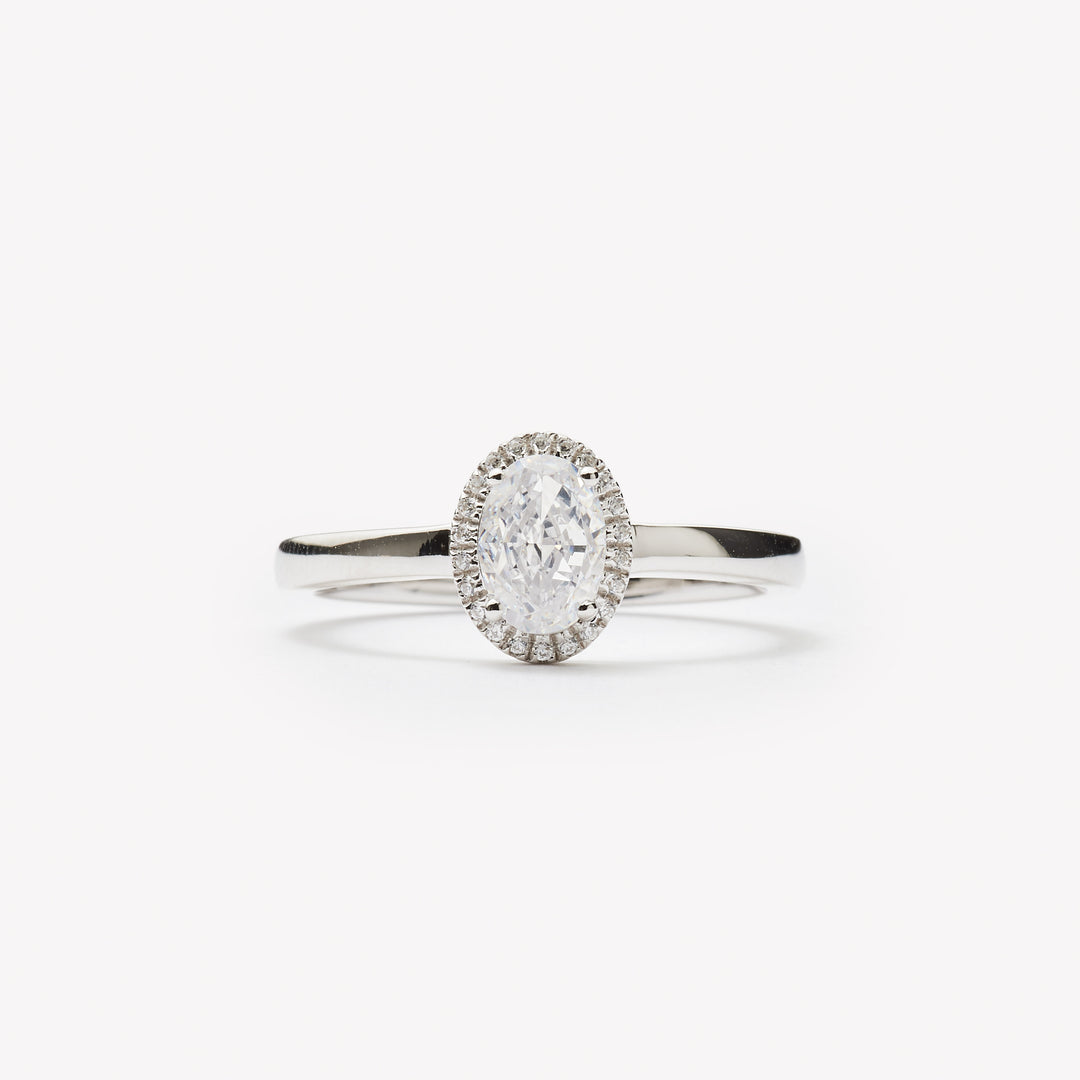 Elegant oval cut engagement ring with halo by IRALIS – Zurich-designed fine jewelry with DEF color and VS1–VS2 clarity.