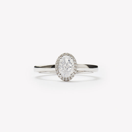 Elegant oval cut engagement ring with halo by IRALIS – Zurich-designed fine jewelry with DEF color and VS1–VS2 clarity.