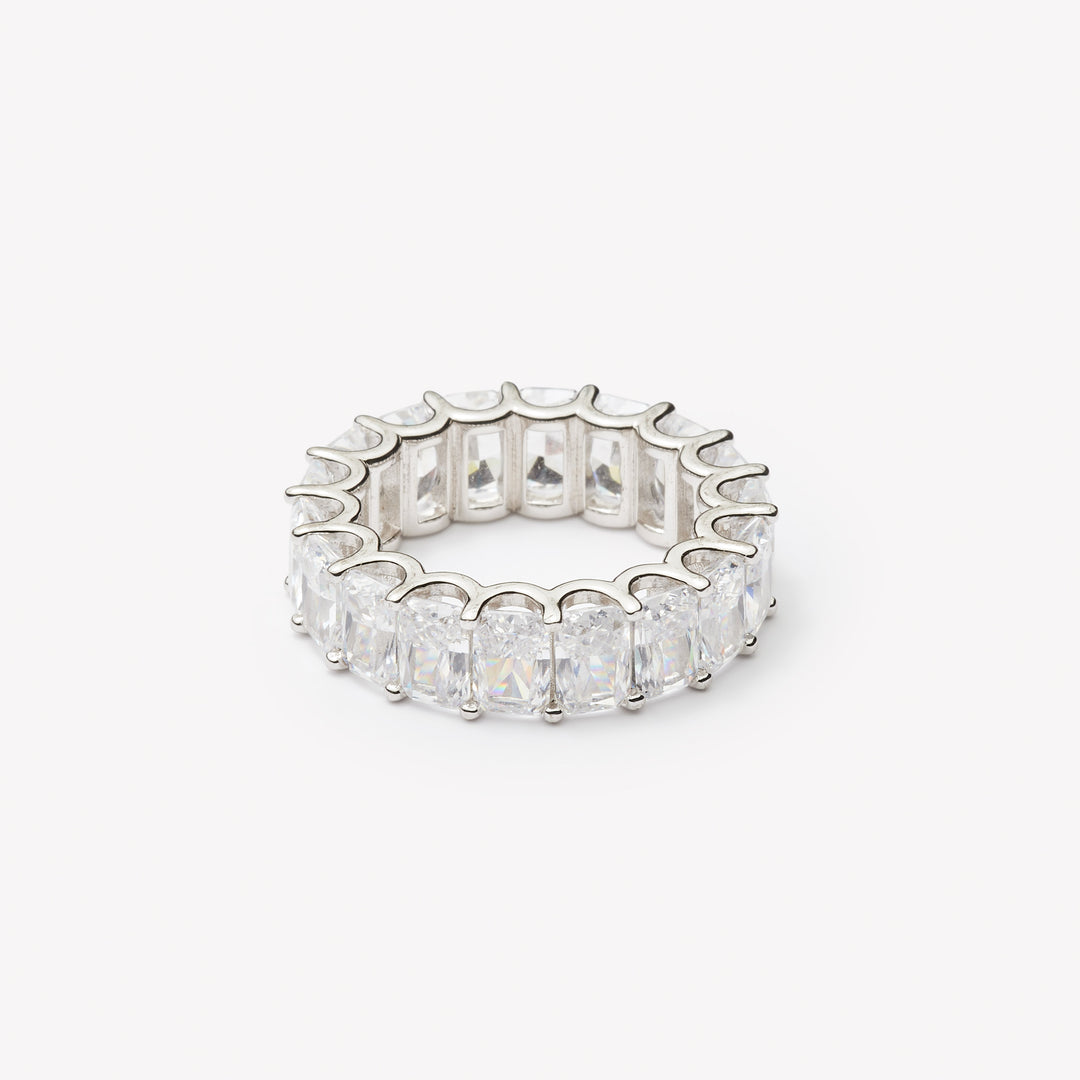 Radiant cut eternity ring by IRALIS featuring lab-grown diamonds in DEF color and VS1–VS2 clarity, Zurich designed