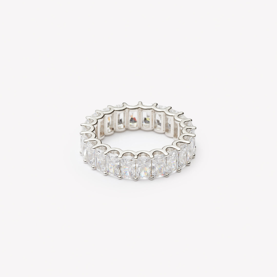 Radiant cut eternity ring by IRALIS featuring lab-grown diamonds in DEF color and VS1–VS2 clarity, Zurich designed