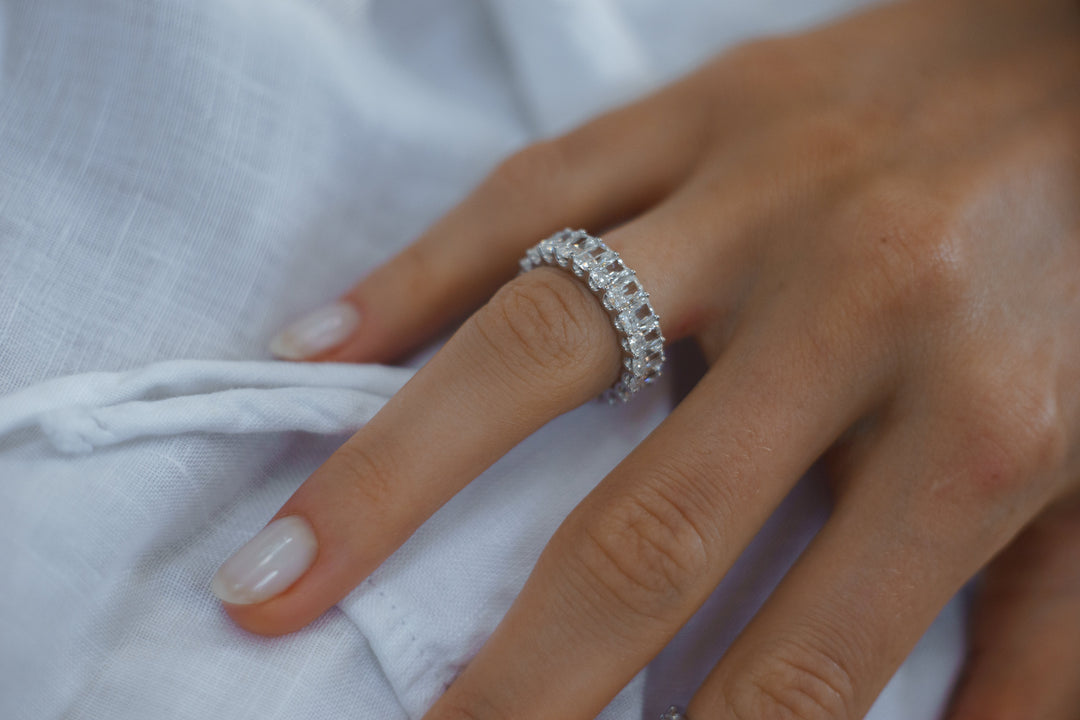 Radiant cut eternity ring by IRALIS featuring lab-grown diamonds in DEF color and VS1–VS2 clarity, Zurich designed