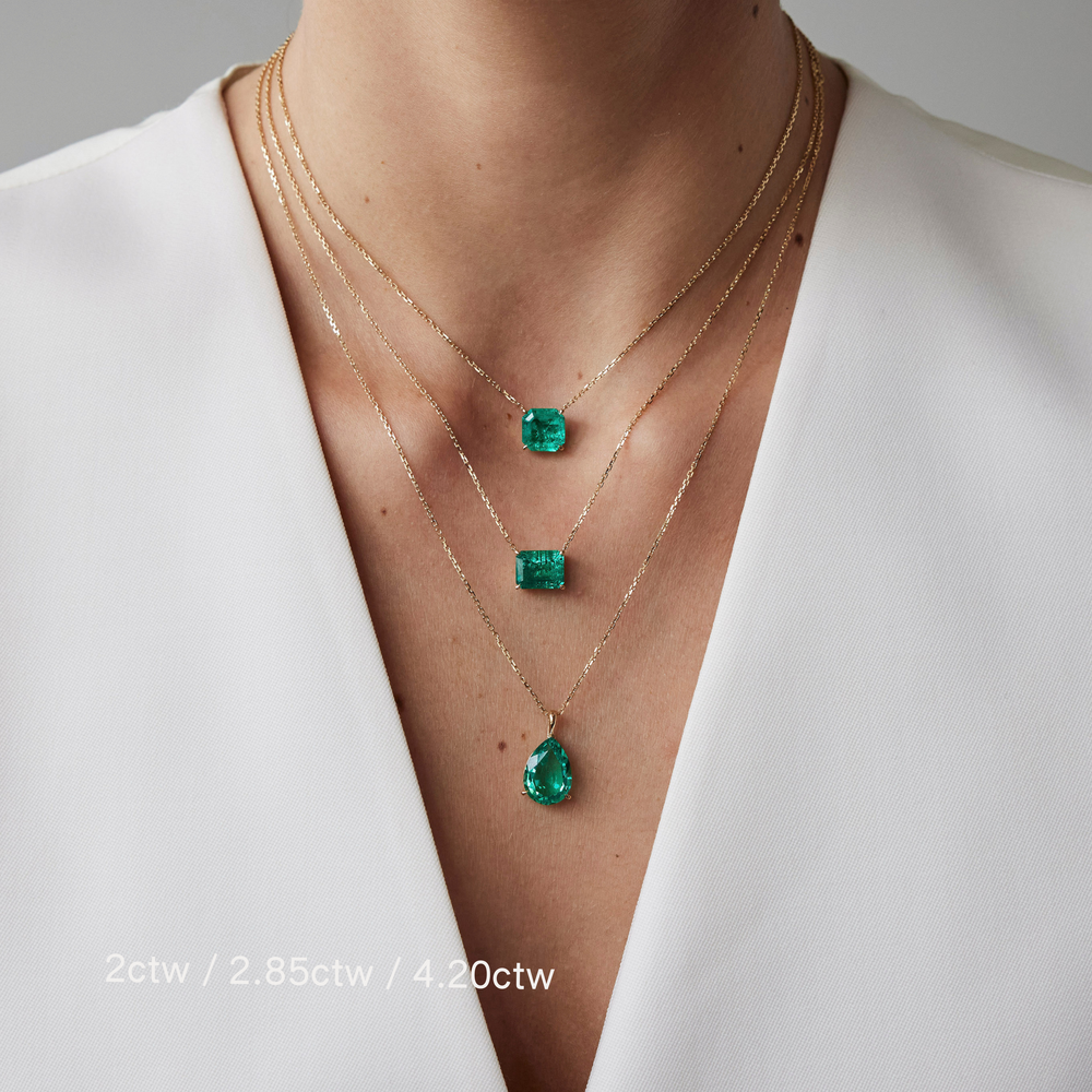 Asscher cut necklace by IRALIS featuring lab-grown emeralds, Zurich designed in a bold and elegant silhouette on model