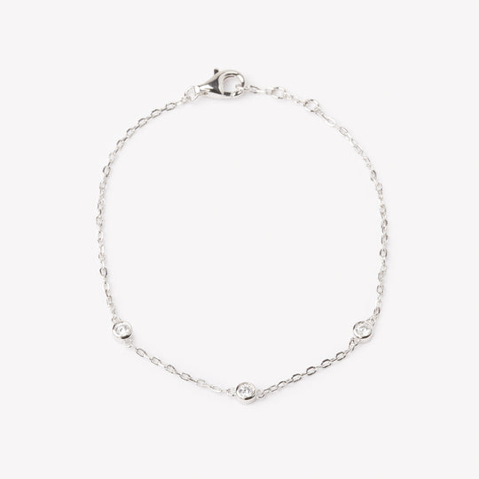 18k white gold bracelet with multiple round brilliant cut diamonds. Adjustable to different lengths.