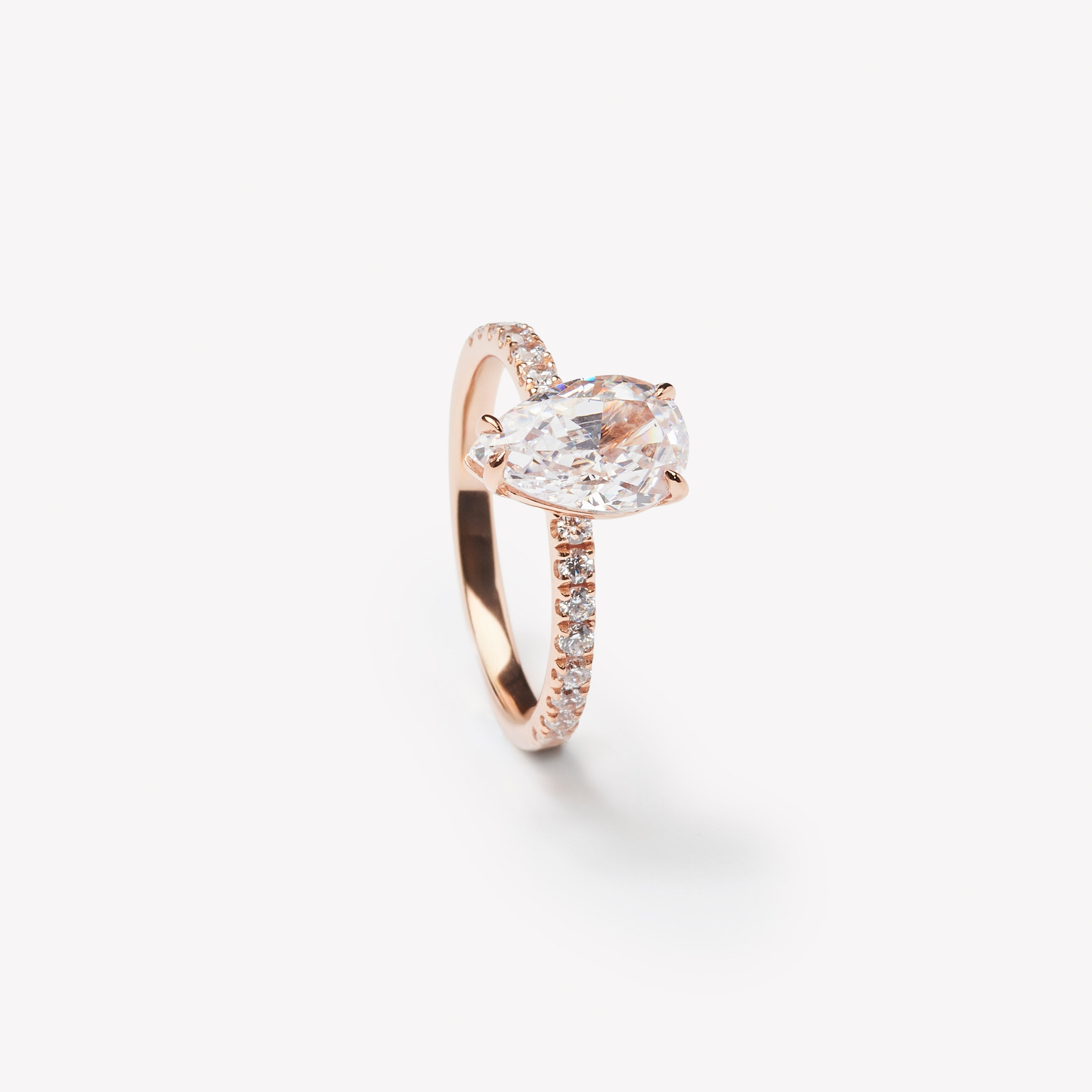 Elegant pear cut engagement ring by IRALIS – Zurich-designed fine jewelry with pave setting, DEF color and VS1–VS2 clarity.