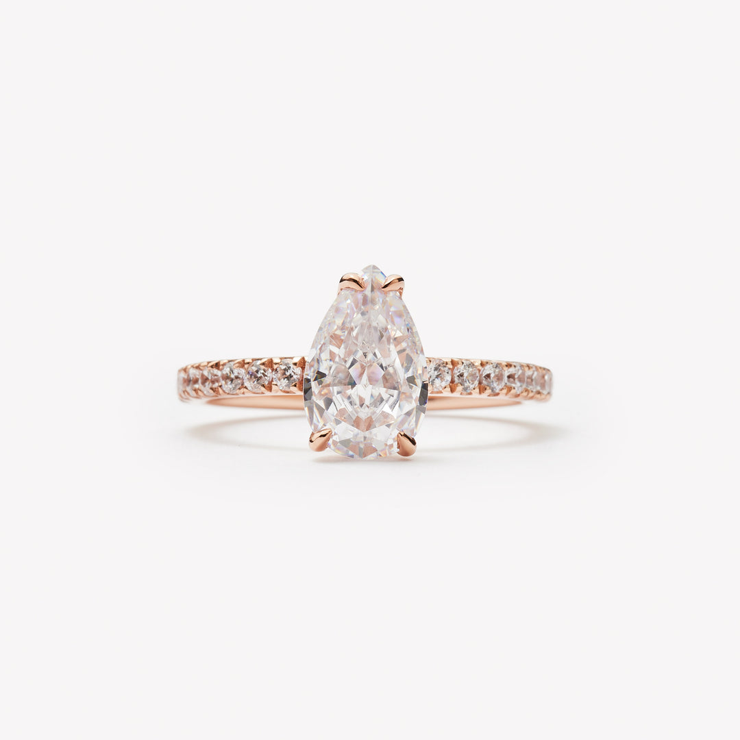 Elegant pear cut engagement ring by IRALIS – Zurich-designed fine jewelry with pave setting, DEF color and VS1–VS2 clarity.