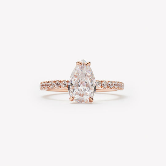 Elegant pear cut engagement ring by IRALIS – Zurich-designed fine jewelry with pave setting, DEF color and VS1–VS2 clarity.