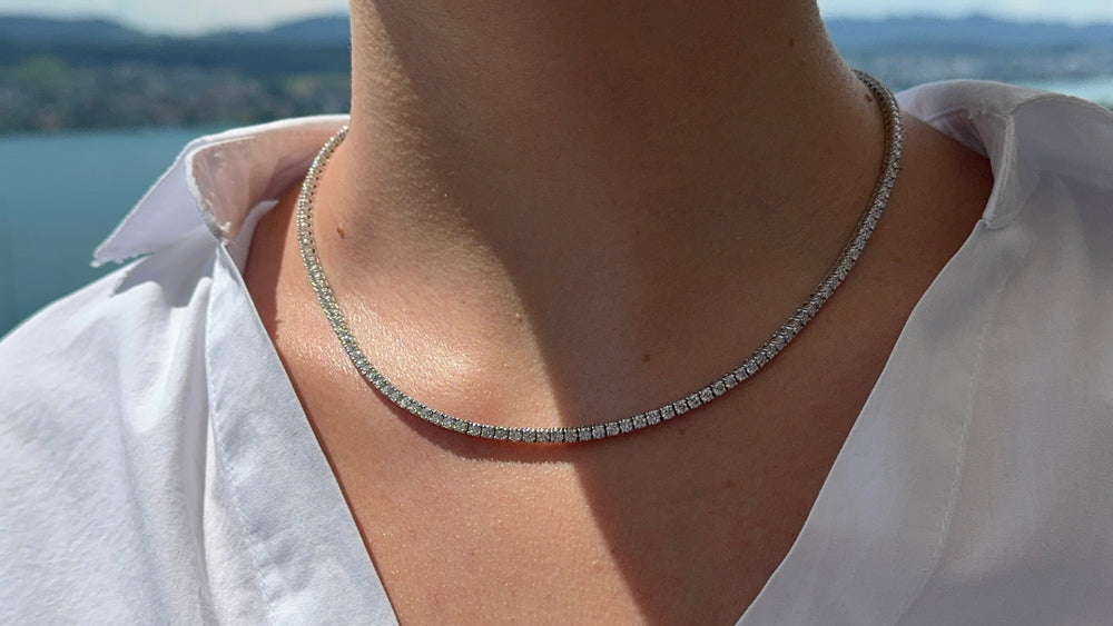 Round brilliant cut tennis necklace by IRALIS featuring lab-grown DEF color diamonds in four-prong setting, Zurich designed on model