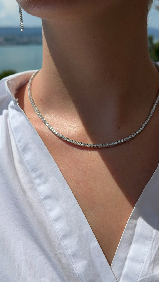 Round brilliant cut tennis necklace by IRALIS featuring lab-grown DEF color diamonds in four-prong setting, Zurich designed on model