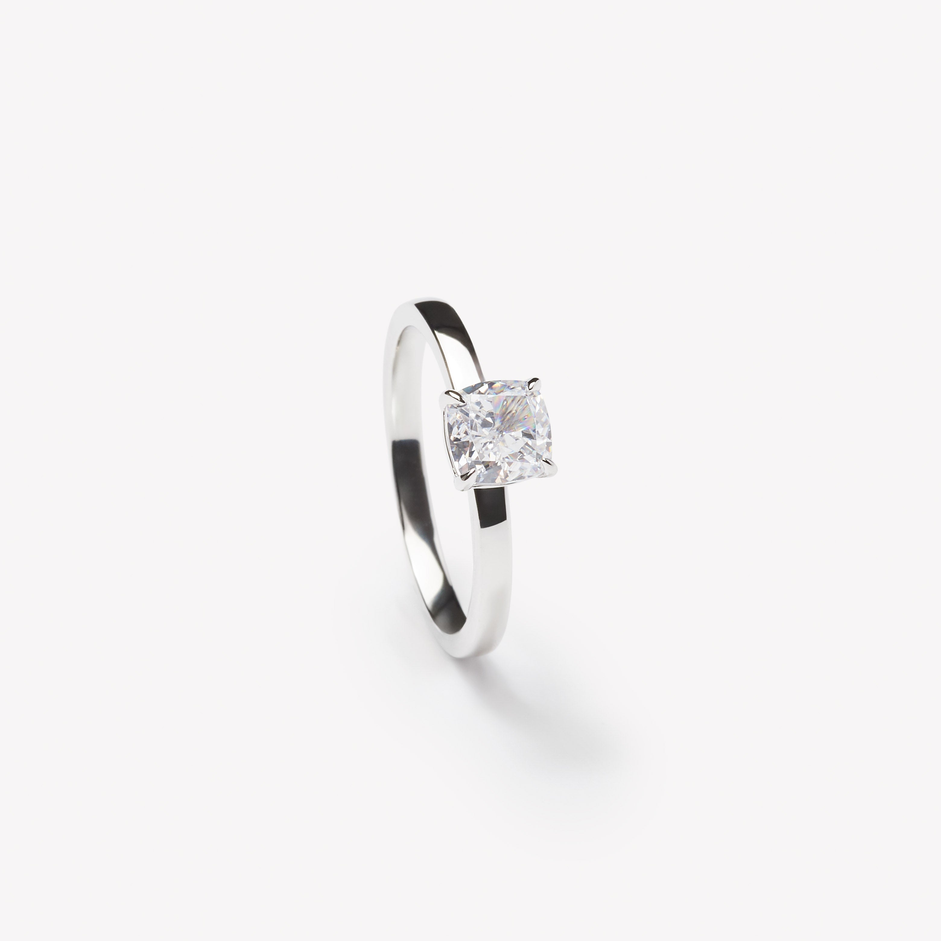 Cushion cut engagement ring by IRALIS – Zurich-designed fine jewelry with DEF color and VS1–VS2 clarity. 
