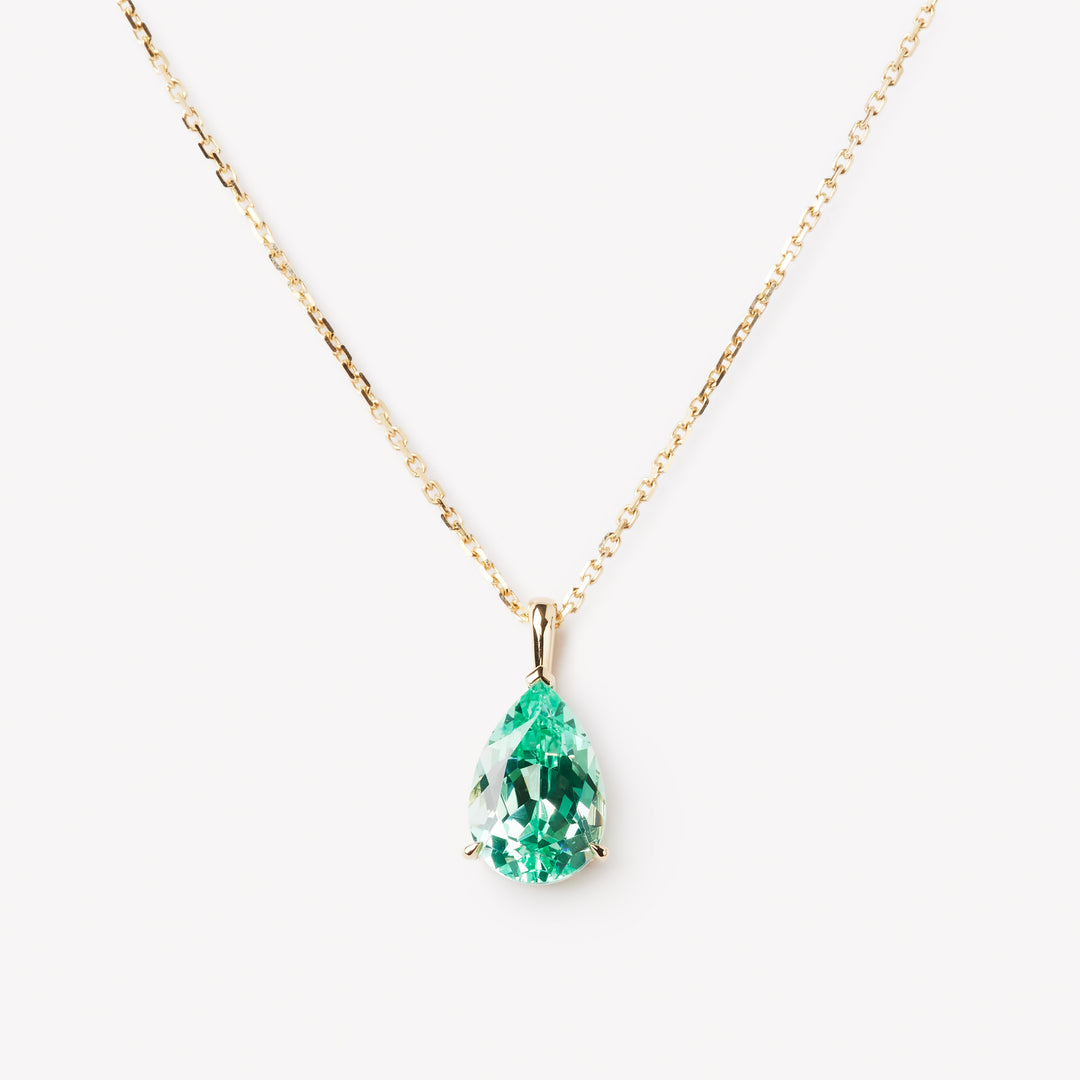 Pear cut necklace by IRALIS featuring lab-grown Paraiba stones in vibrant turquoise, Zurich designed and custom made

