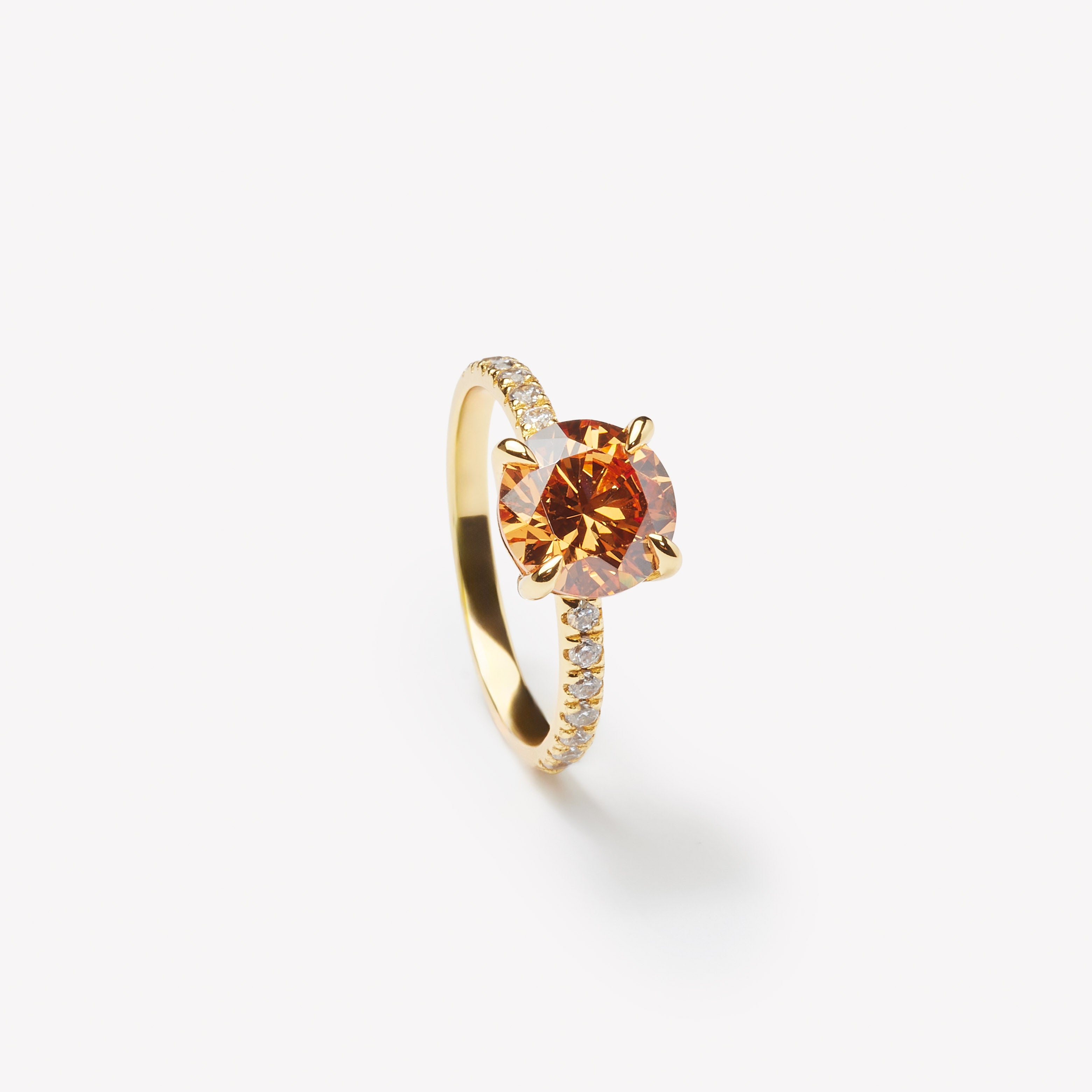 IRALIS engagement ring with round cut champagne diamond – Zurich-designed fine jewelry, pave setting, VS1–VS2 clarity.