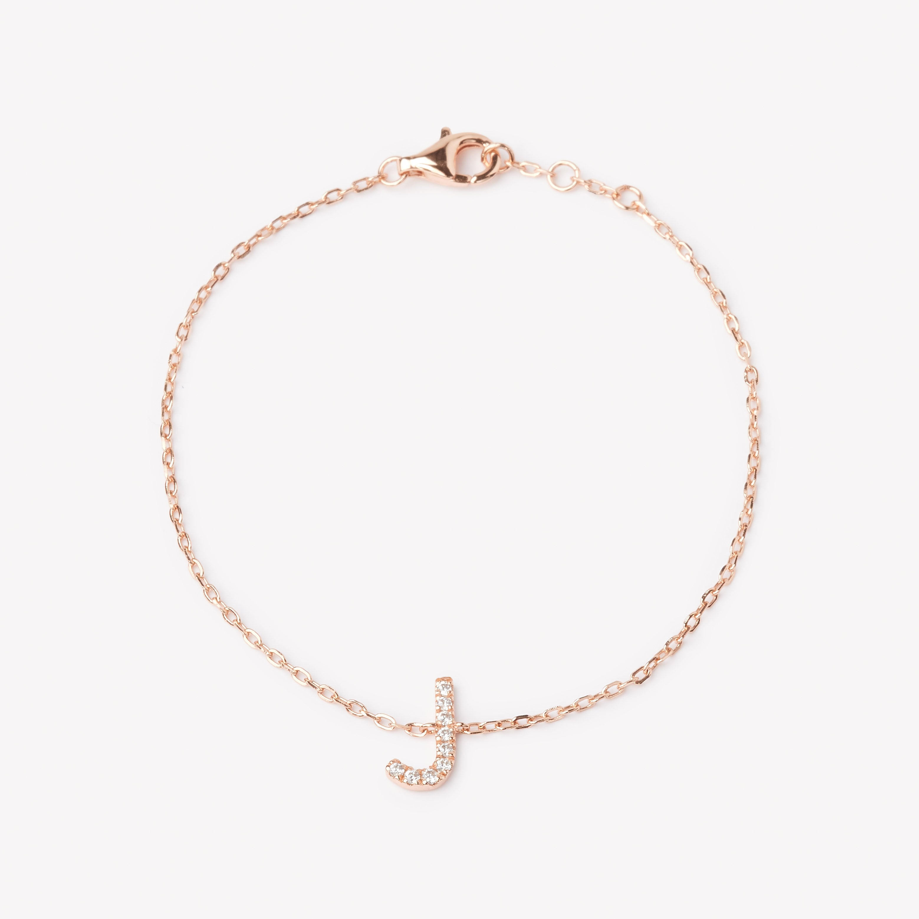 18k rose gold initial bracelet with a lab grown diamond letter 'J' charm. 