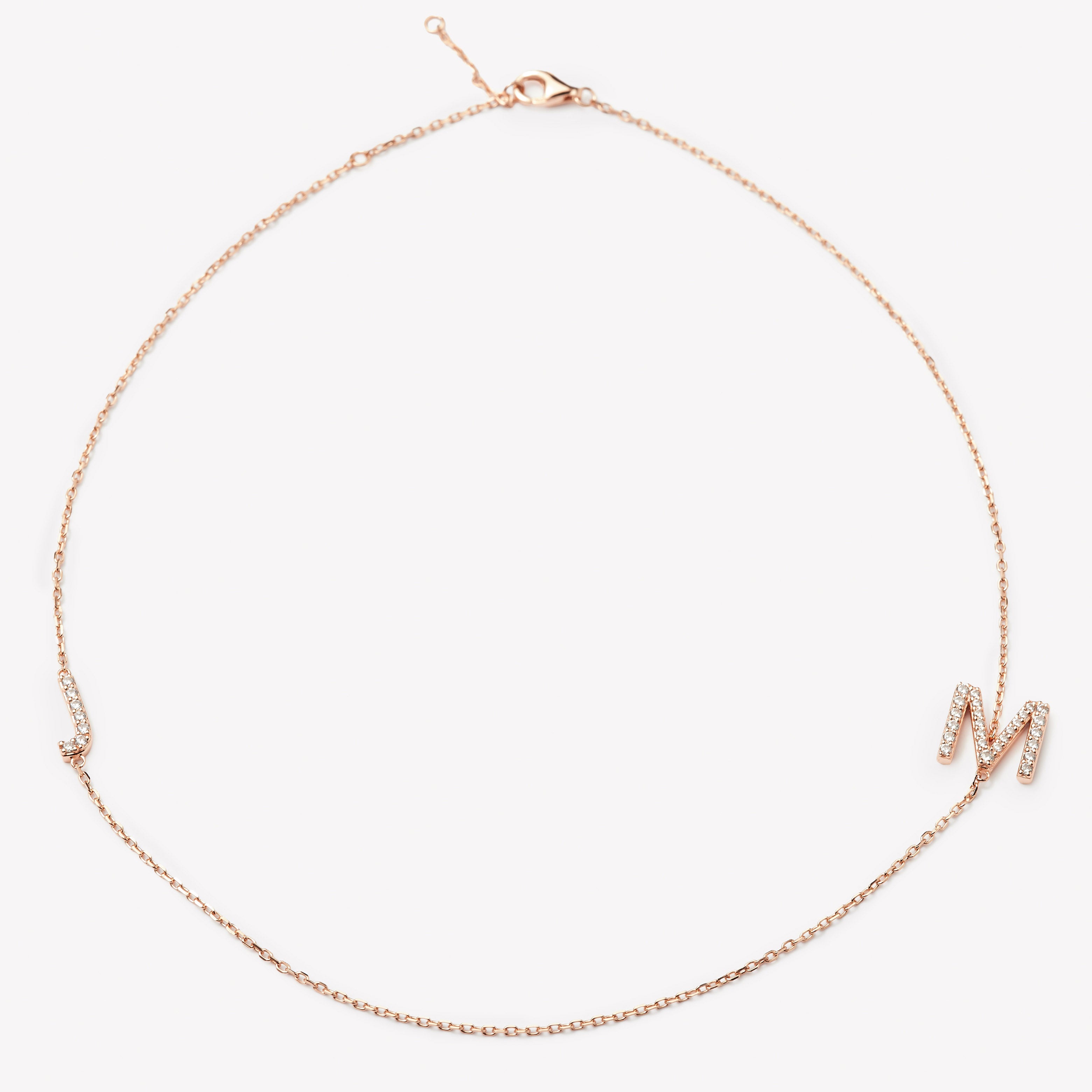 Custom initial necklace by IRALIS with lab-grown DEF round diamonds and large 10–12 mm letters, Zurich designed