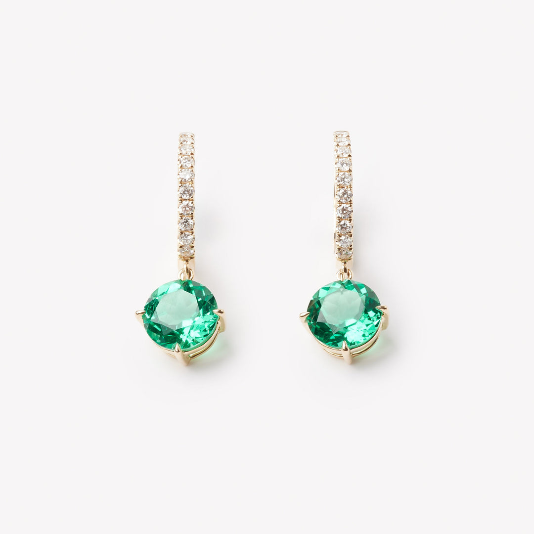 18k gold lab grown diamond and emerald earrings. Round brilliant emerald and diamond-adorned loop. 