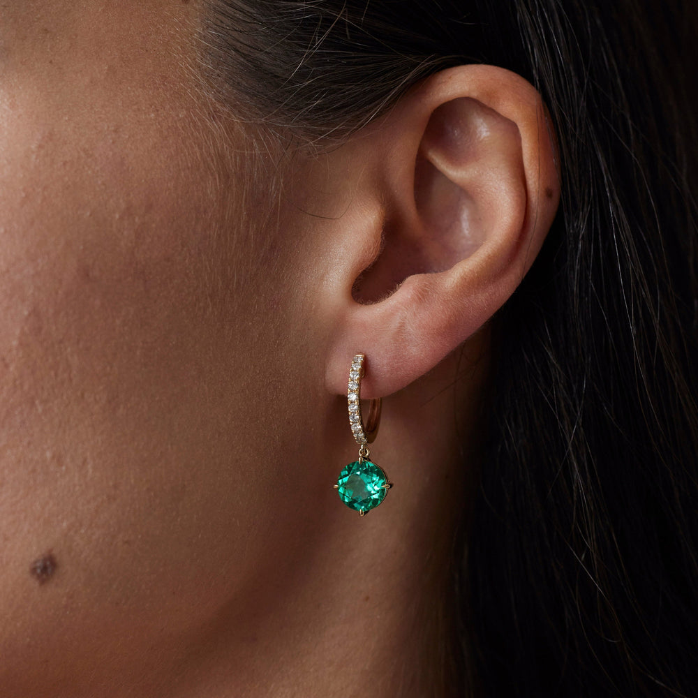 18k gold lab grown diamond and emerald earrings. Round brilliant emerald and diamond-adorned loop. 