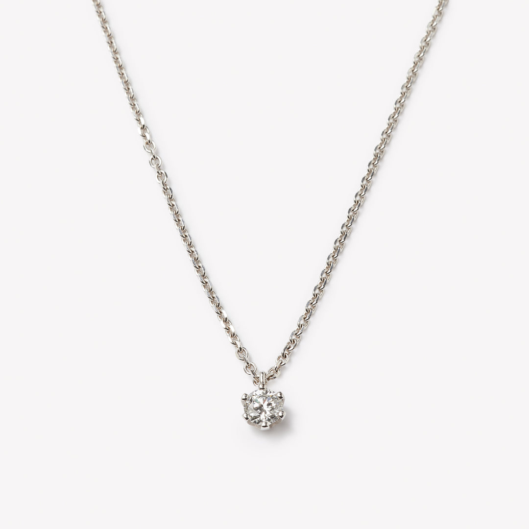 Round brilliant cut necklace by IRALIS featuring lab-grown DEF color diamonds on 18k anker chain, Zurich designed