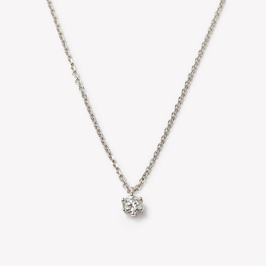 Round brilliant cut necklace by IRALIS featuring lab-grown DEF color diamonds on 18k anker chain, Zurich designed