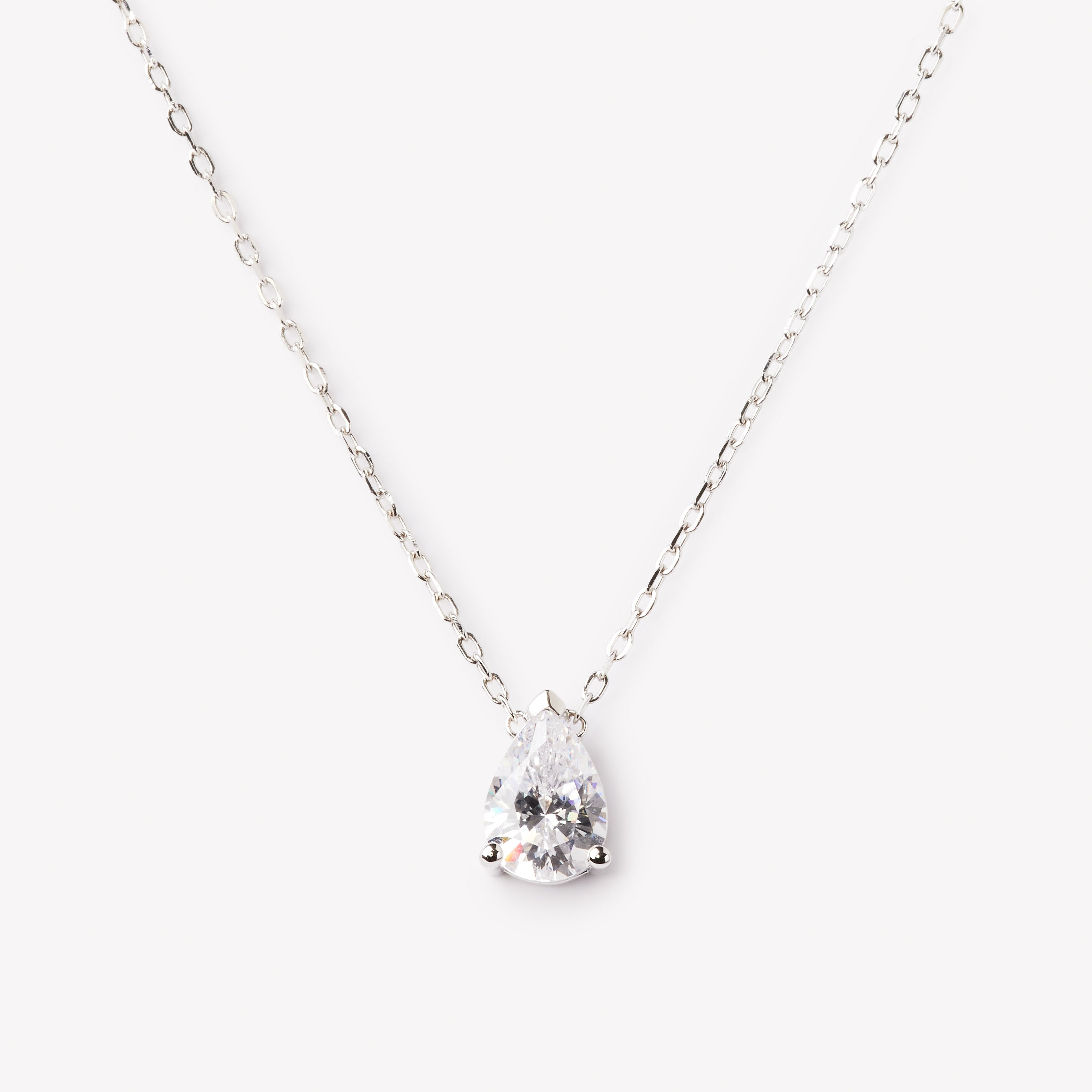 Elegant pear cut necklace by IRALIS featuring lab-grown DEF color diamonds in 18k gold, Zurich designed on model