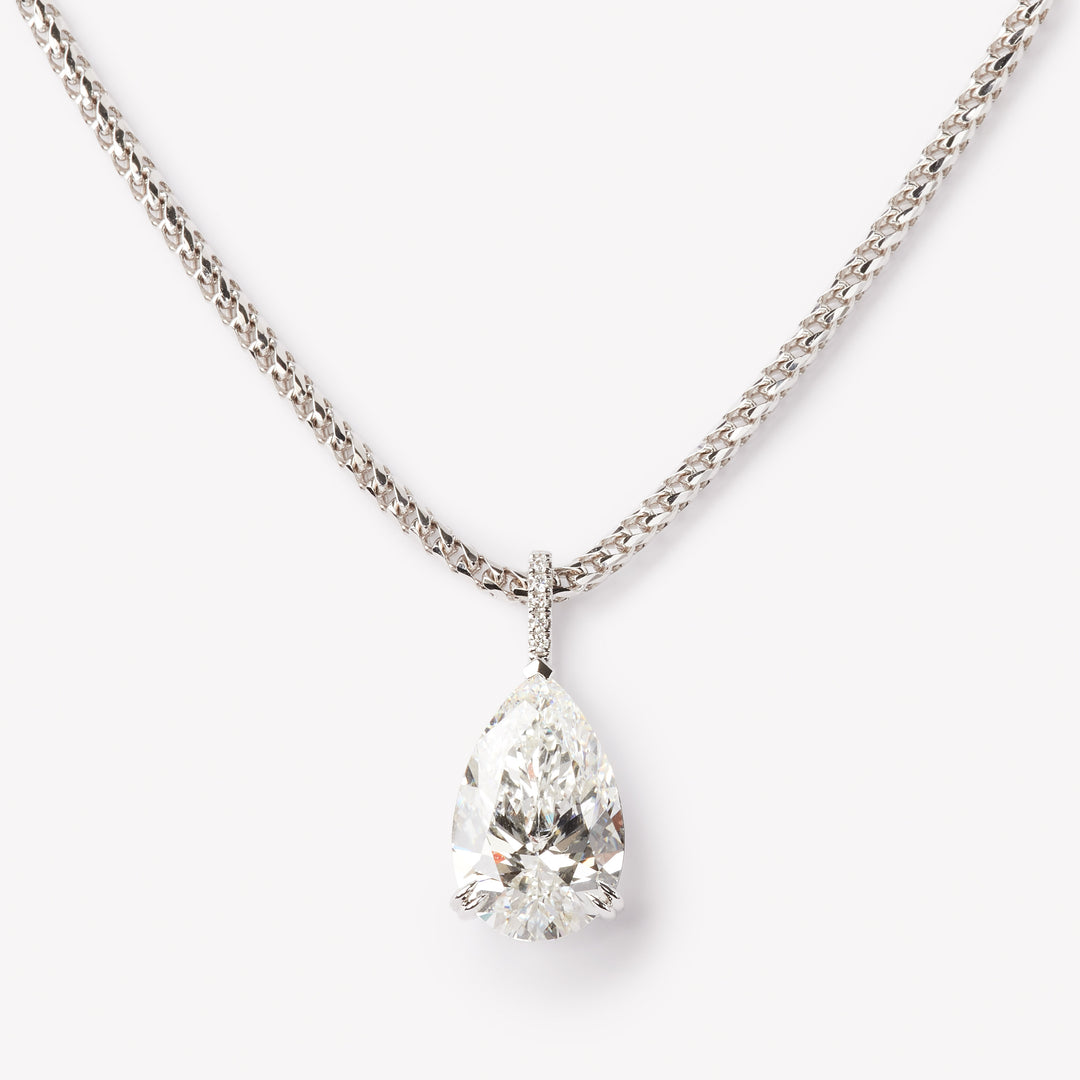 Elegant pear cut necklace by IRALIS featuring lab-grown DEF color diamonds in 18k gold, Zurich designed on model