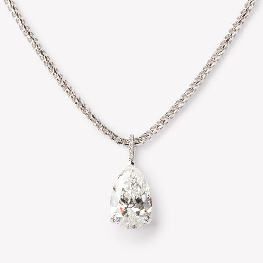 Elegant pear cut necklace by IRALIS featuring lab-grown DEF color diamonds in 18k gold, Zurich designed on model
