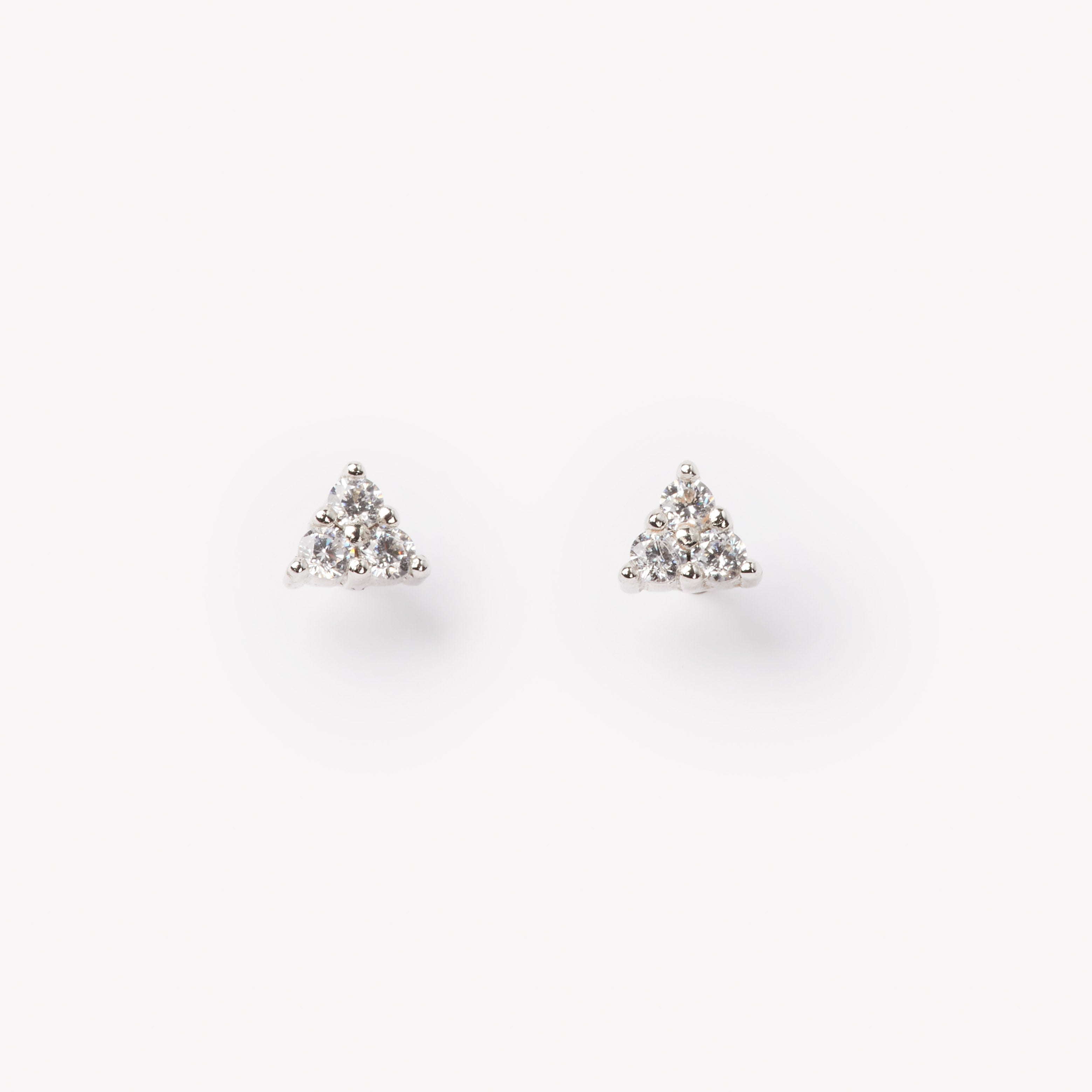 18k gold lab grown diamond studs. round brilliant diamonds in triangular shape. 