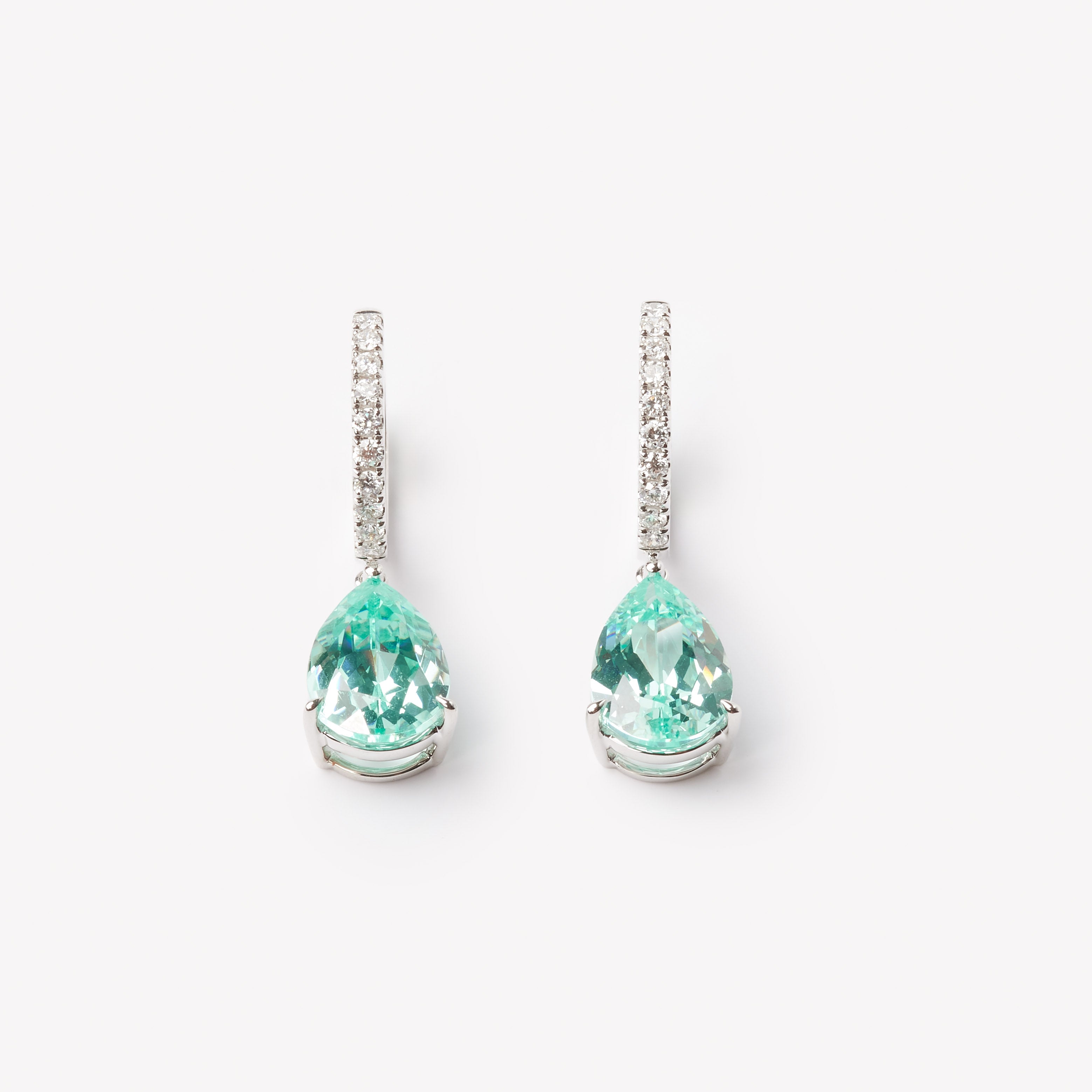 18k gold lab grown paraiba with diamond paved loop. Pear cut in tiger claw setting.