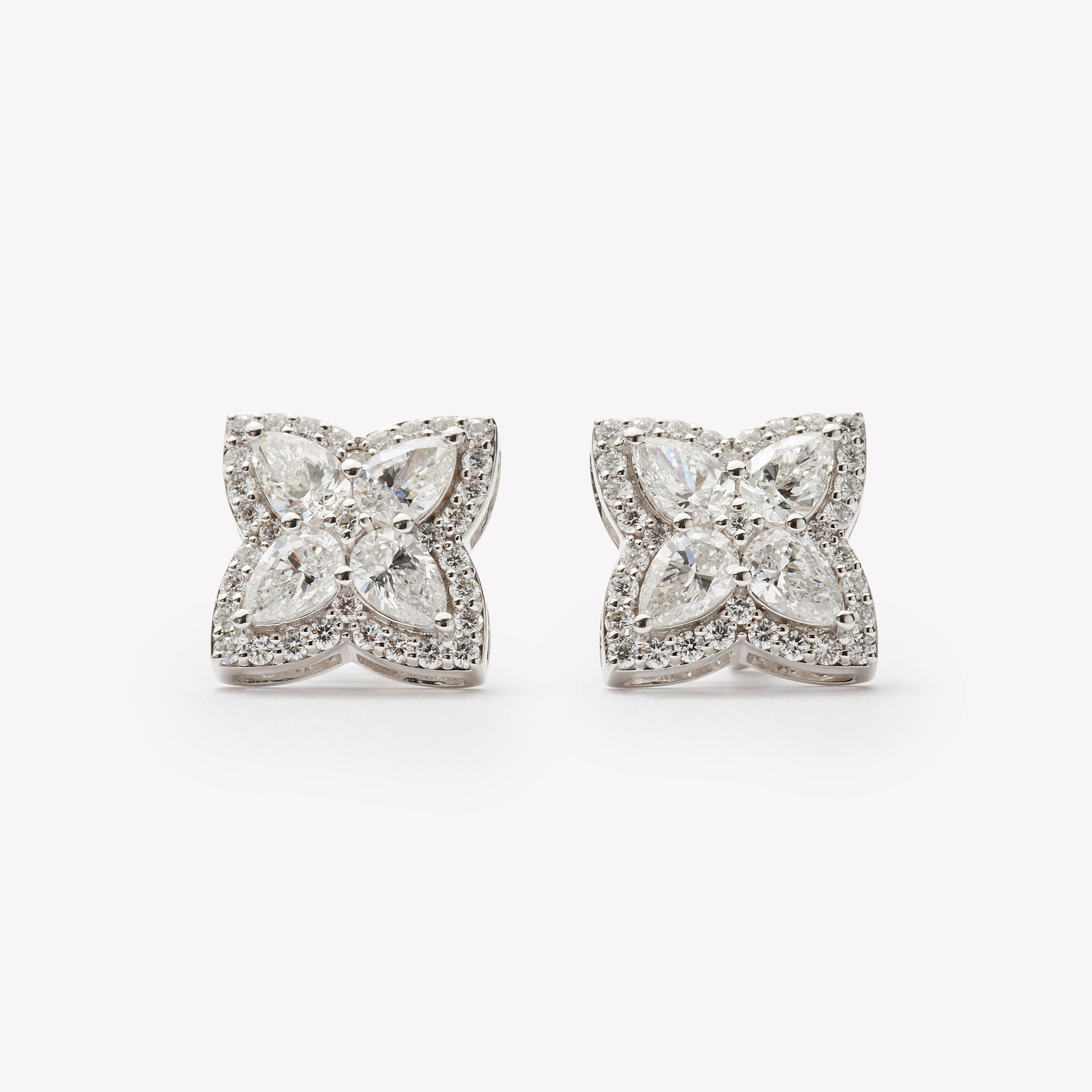 18k white gold lab grown diamond studs. Four pear cut diamonds embedded in round brilliant cut diamonds.